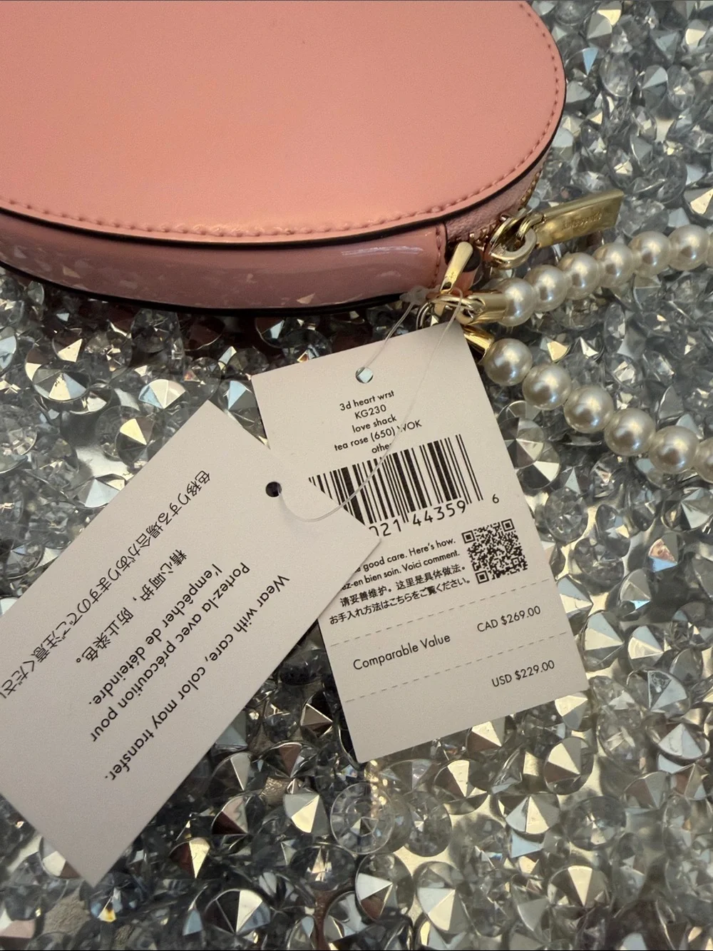 kate spade pink heart-shaped pearl wristlet clutch